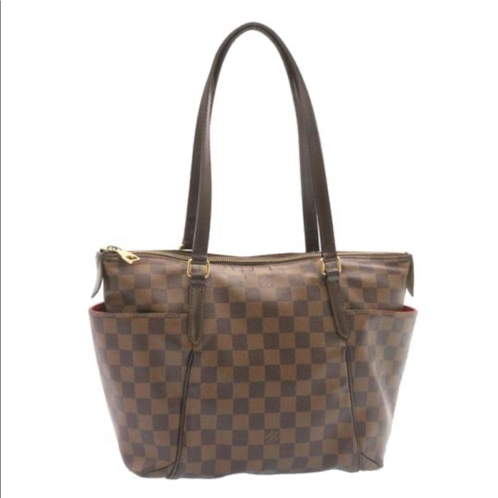 Louis Vuitton’s Damien ebene totally pm bag.